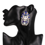Boucles d'oreilles matriochka avec diamants turquoises.