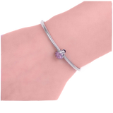 Pendentif matriochka en argent 925 et diamants violets.