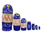 Poupée Russe bleue 7 pièces avec ornements dorés et motifs fleurs.